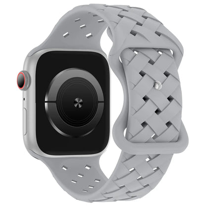 Apple Watch with grey braided silicone strap, featuring breathable design for comfort during active lifestyles.