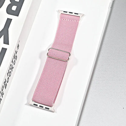 Apple Watch nylon sport loop strap in pink packaging, breathable and versatile for daily wear and workouts.