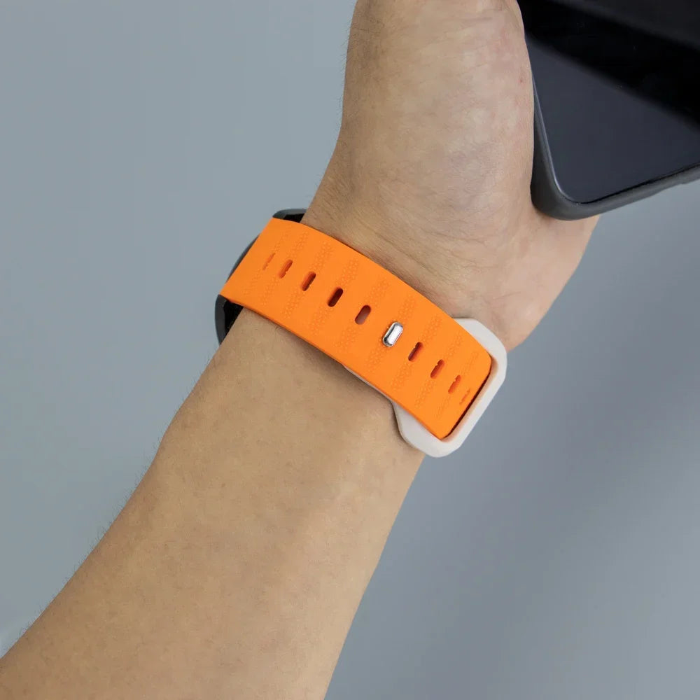Textured Pin-and-Tuck Silicone Band for Motorola Moto — Orange and starlight band worn on wrist