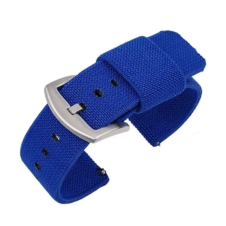 Lightweight blue nylon Suunto watch band with silver buckle, offering comfort and minimal bulk for active users.