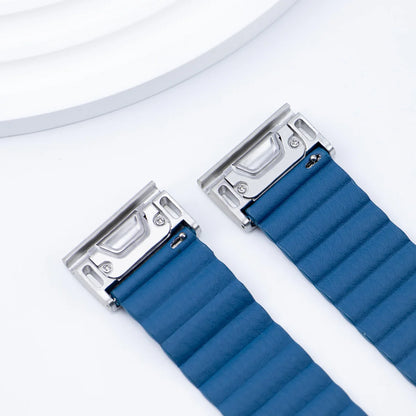 Close-up of a blue replacement Garmin smartwatch band with stainless steel buckle, showcasing its quickfit design.