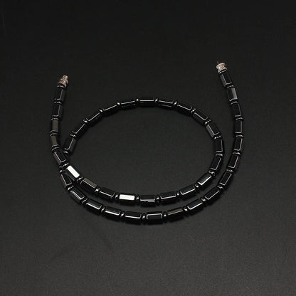 Close-up of the bamboo-shaped simulated hematite beads