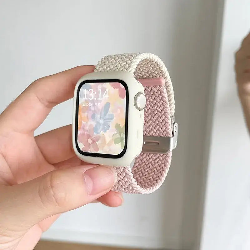 Pink and ivory woven Apple Watch band with white case