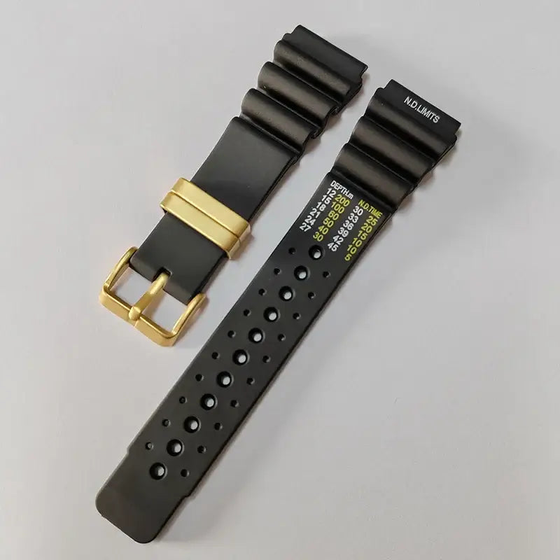 Black silicone strap with gold-tone buckle and keeper