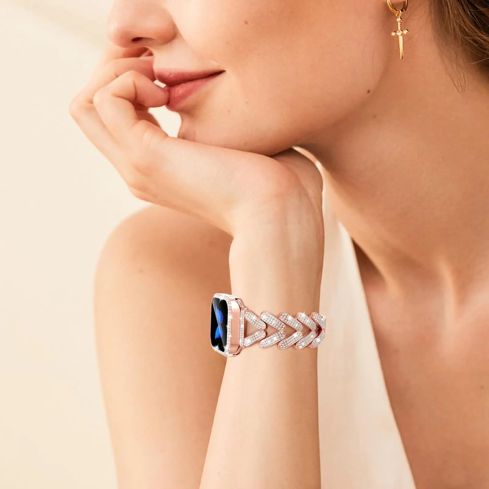 Woman wearing Apple Watch Stainless Steel Band with sparkly crystal design, showcasing elegance and style.