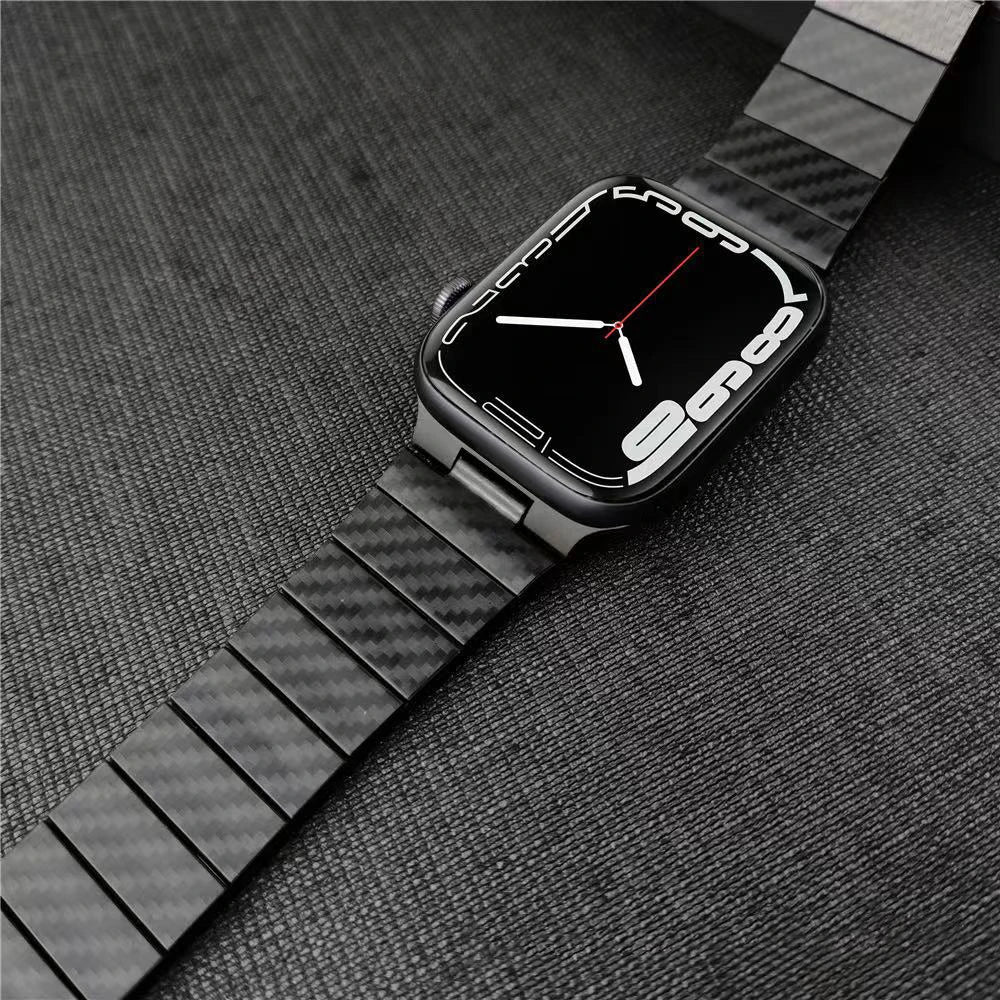 Apple Watch with a sleek carbon fiber strap on a dark background, showcasing modern design and durability.