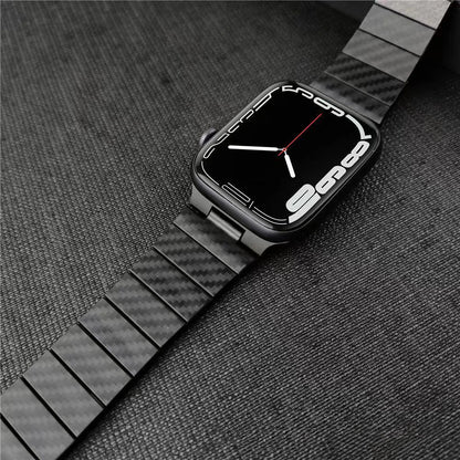 Apple Watch with a sleek carbon fiber strap on a dark background, showcasing modern design and durability.