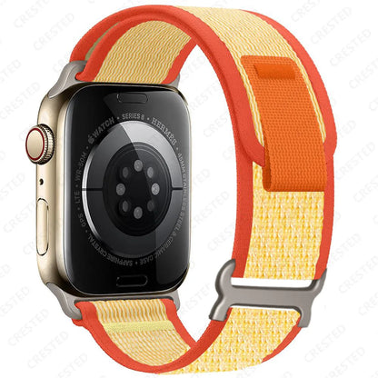 Apple Watch Trail Loop Nylon Strap in vibrant orange and yellow, designed for durability and comfort during workouts.