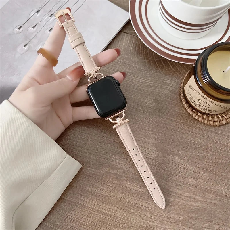 Apple Watch genuine leather strap in light color, showcased on a hand with a minimalist background.