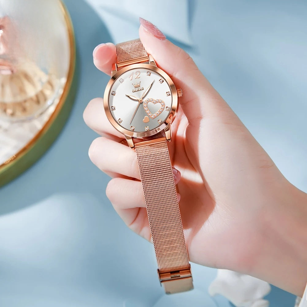 Women's Crystal Heart Mesh Quartz Watch — White heart dial watch held in hand — BandsCo Straps