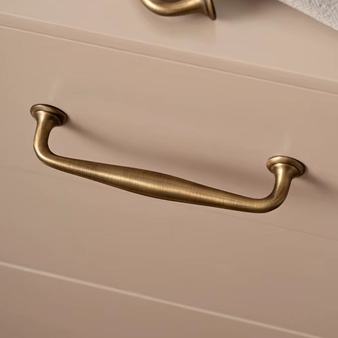 Arched solid brass cabinet pull in antique brass