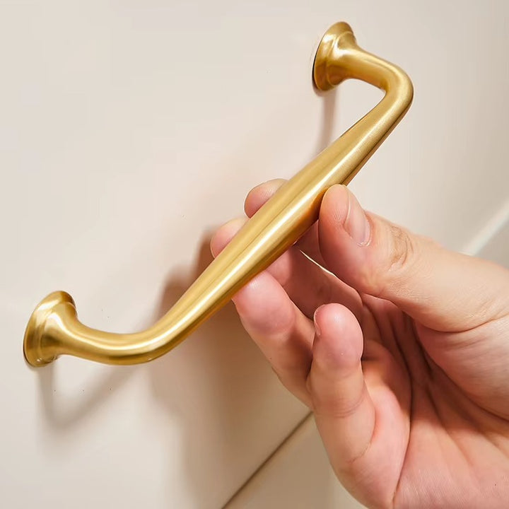 Arched solid brass cabinet pull in brushed brass