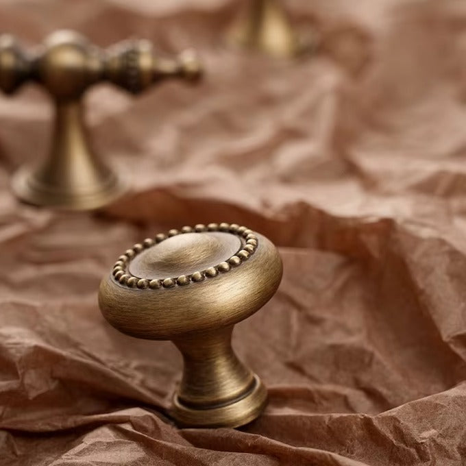 Beaded solid brass round cabinet knob in antique brass
