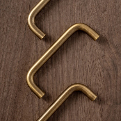 U-shaped solid brass wire cabinet pull in antique brass