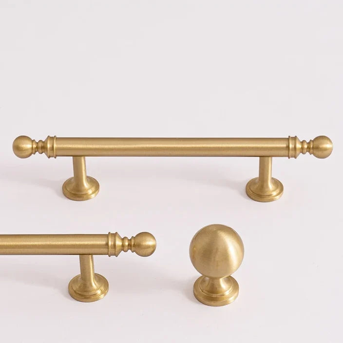 Classic ball solid brass cabinet pulls and a matching ball knob in brushed brass