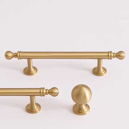 Classic ball solid brass cabinet pulls and a matching ball knob in brushed brass