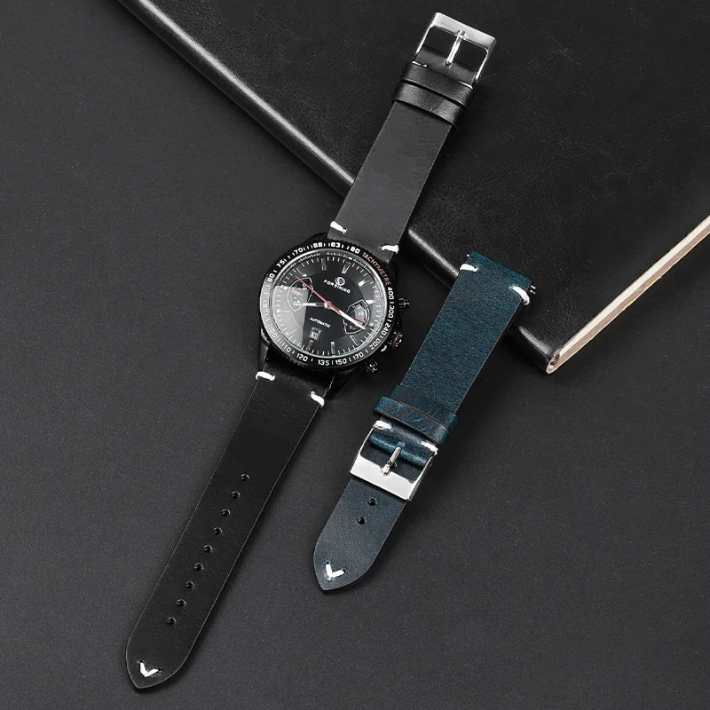 Black leather band worn on watch beside blue strap for COROS – BandsCo Straps