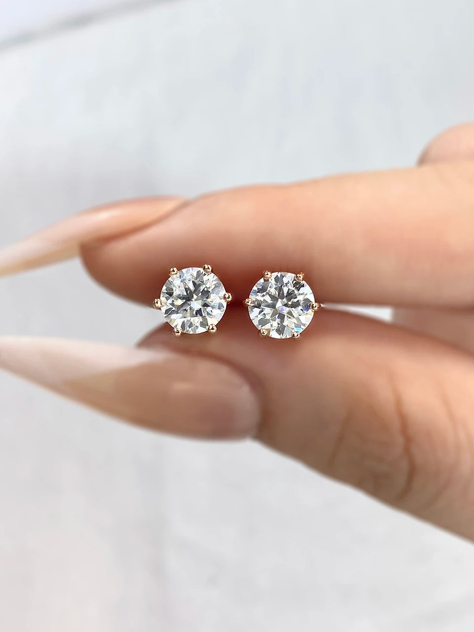 Six-Prong Moissanite Stud Earrings in Sterling Silver - rose gold-tone close-up