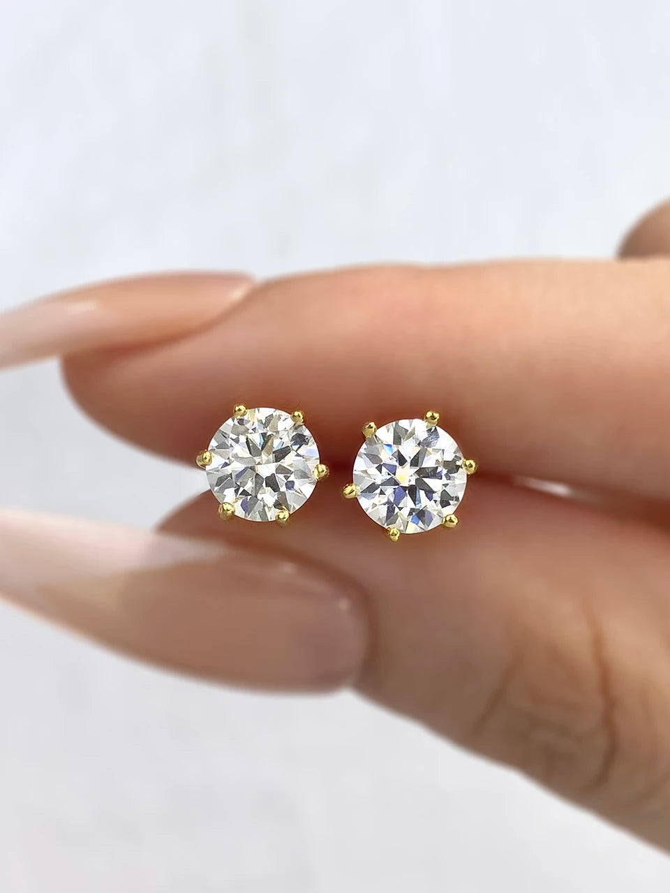 Six-Prong Moissanite Stud Earrings in Sterling Silver - gold-tone close-up