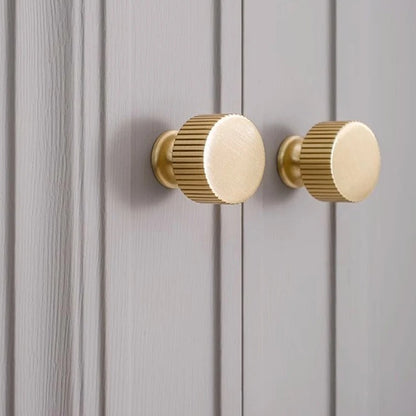 Fluted solid brass round cabinet knob in brushed brass