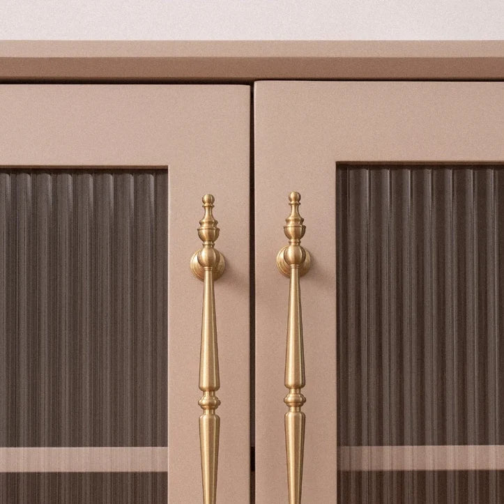 French spire solid brass cabinet pulls in brushed brass on cabinet doors