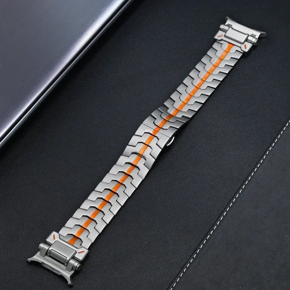 Titanium-gray steel watch band with orange stripe laid flat for Samsung Galaxy Watch8, Watch8 Classic and Watch9