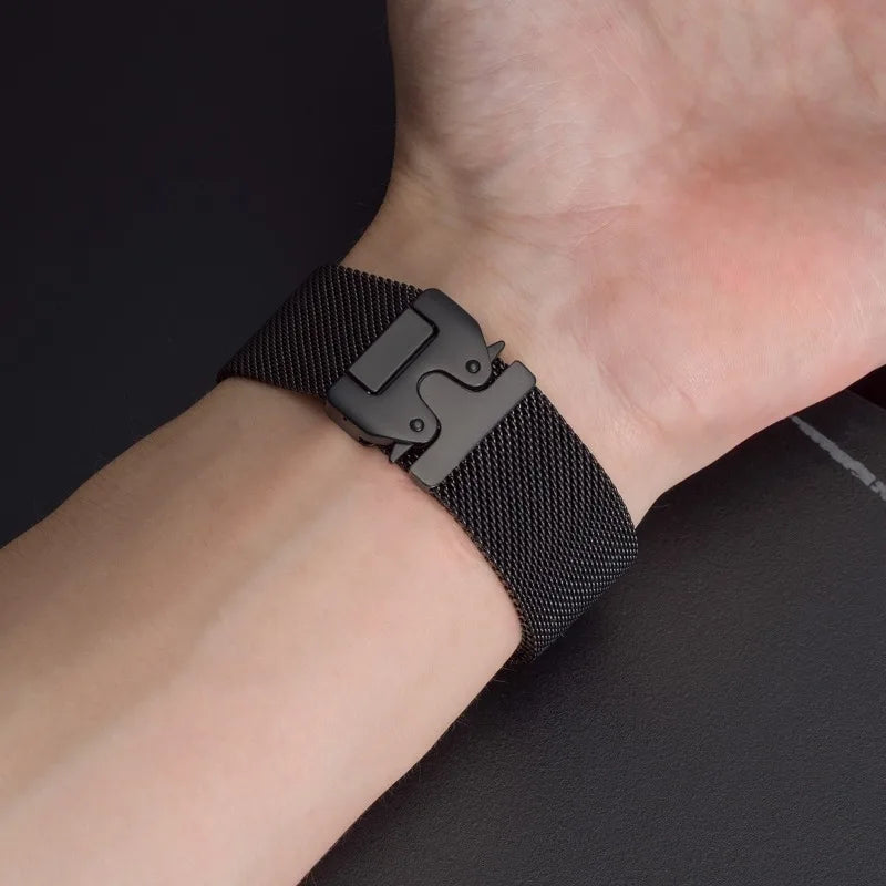 Black mesh band worn on a wrist