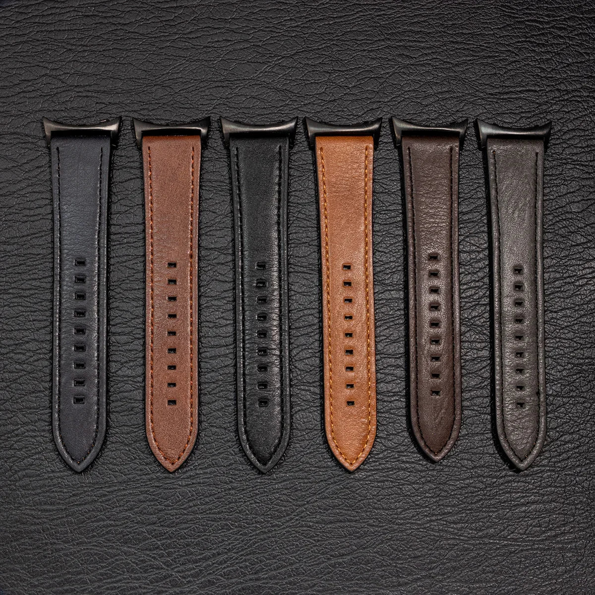 Six leather strap colors laid flat