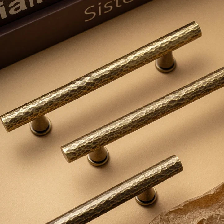 Hand-hammered solid brass cabinet pulls in antique brass
