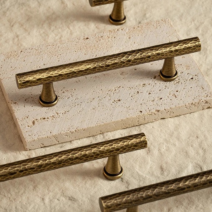 Hand-hammered solid brass T-bar cabinet knob in antique brass