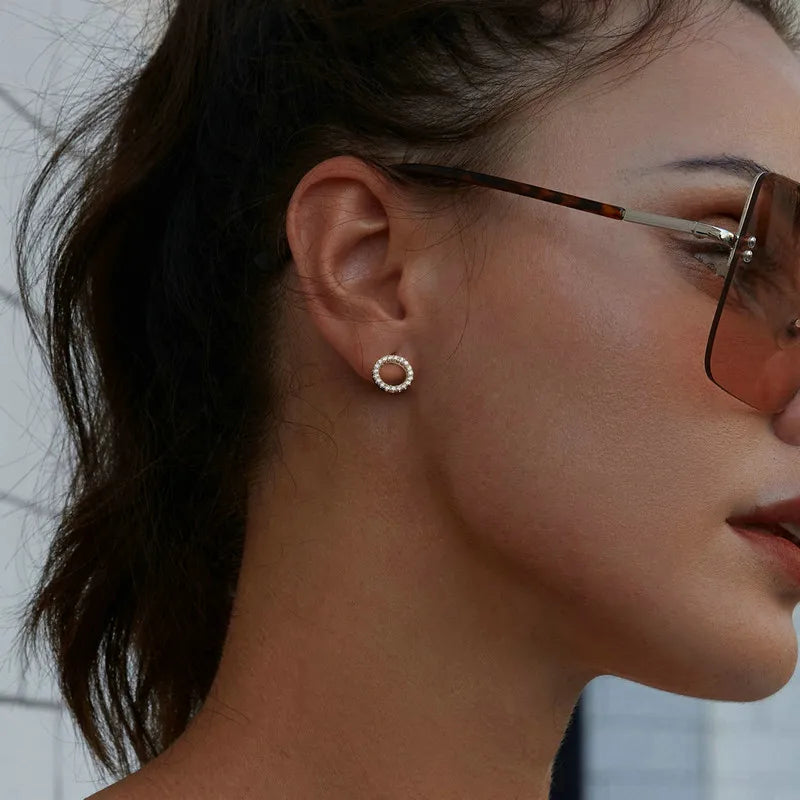 Open Circle Moissanite Stud Earrings in Sterling Silver — Circle stud worn on the ear