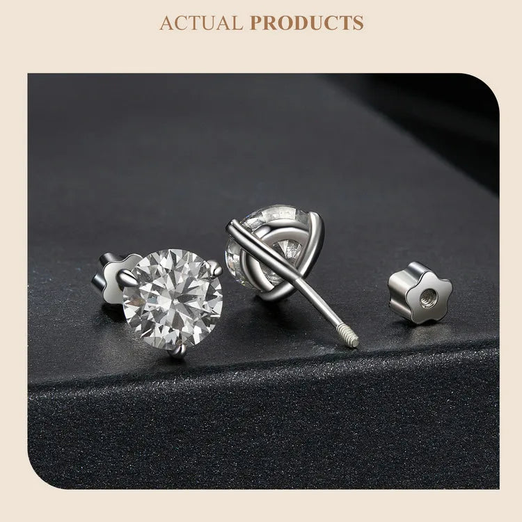 Three-Prong Moissanite Push-Back Stud Earrings in Silver — Pair on dark surface