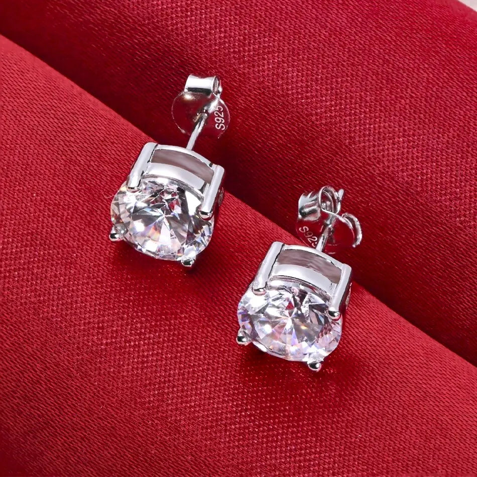 Round Four-Prong Moissanite Stud Earrings in Sterling Silver — Angled basket view