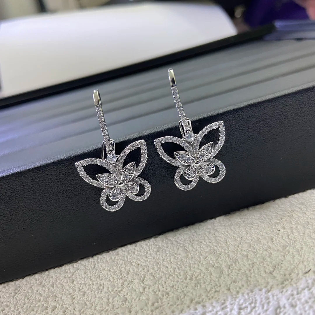 Openwork Butterfly Moissanite Drop Earrings in Silver — Openwork butterflies on display