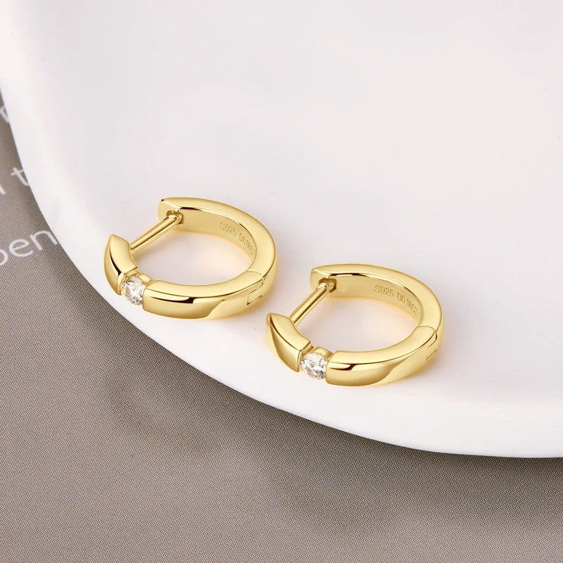 Minimalist Moissanite Hoop Earrings in Sterling Silver — Gold-Tone pair laid flat