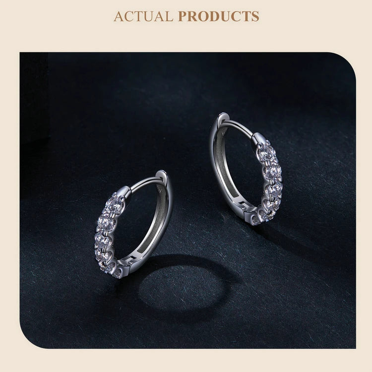 Moissanite Row Huggie Hoop Earrings in Sterling Silver - Hoop pair on dark background