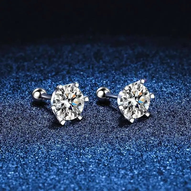 Moissanite screw-back stud earrings in sterling silver — White-stone pair on blue fabric