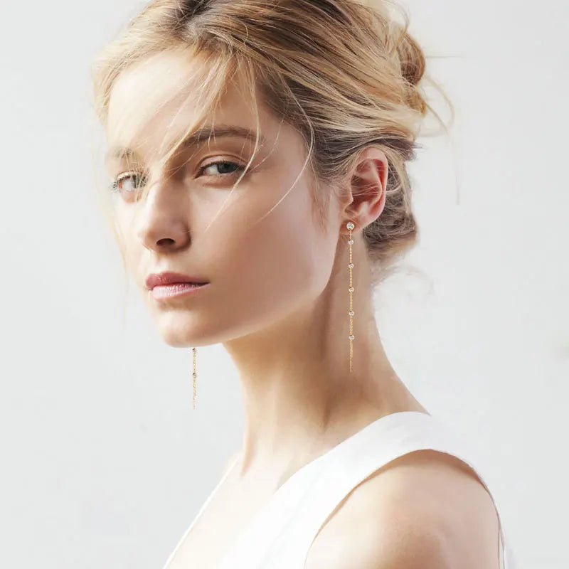 Long Moissanite Station Chain Earrings in Sterling Silver — Layered chains styled on the ear