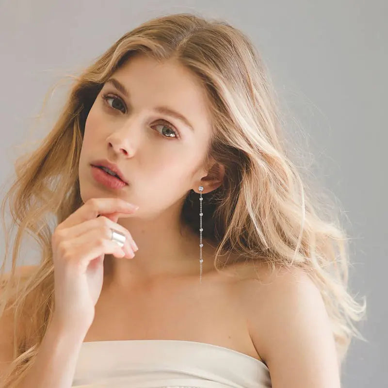 Long Moissanite Station Chain Earrings in Sterling Silver — Station chain earrings worn on the ear