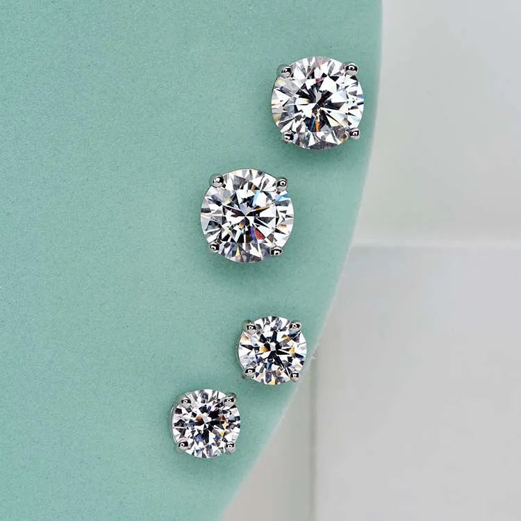 Four-Prong Round Moissanite Stud Earrings in Silver — Stone size comparison