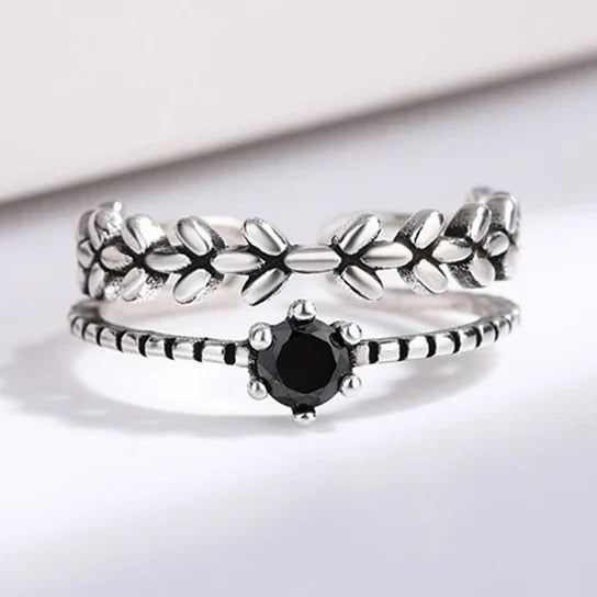Front view of the obsidian leaf ring, black stone on a beaded band