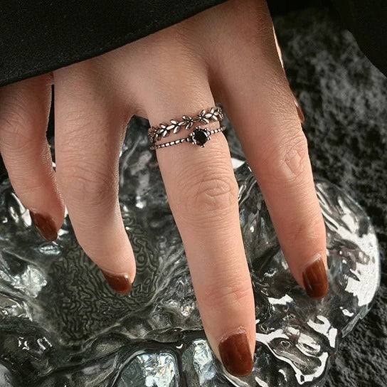 Obsidian leaf ring worn on the hand