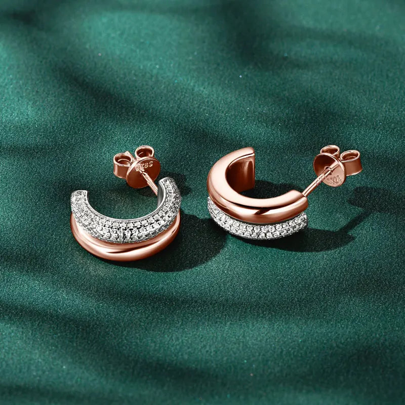 Double-Row C-Shaped Moissanite Stud Earrings - Rose gold-tone pair on green background