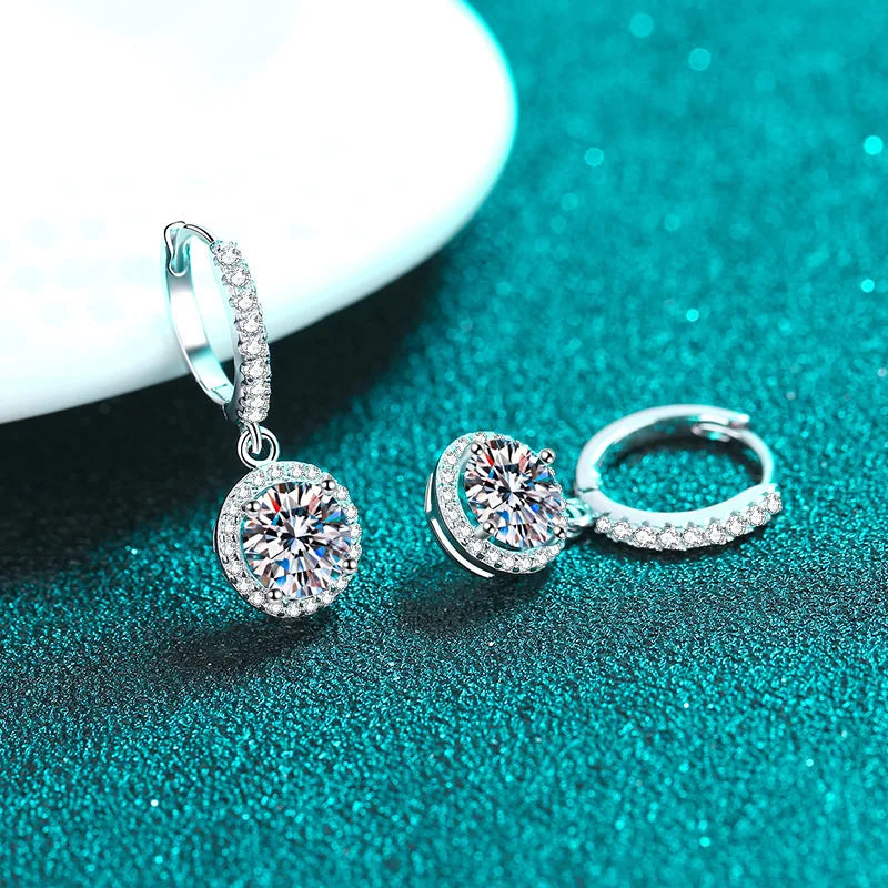 Colored Halo Moissanite Hoop Drop Earrings in Silver — White drops on turquoise surface