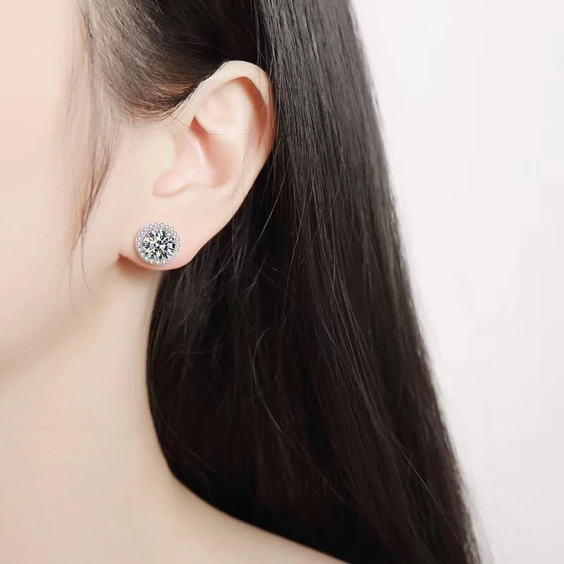 Round Halo Moissanite Stud Earrings in Sterling Silver — Worn on ear