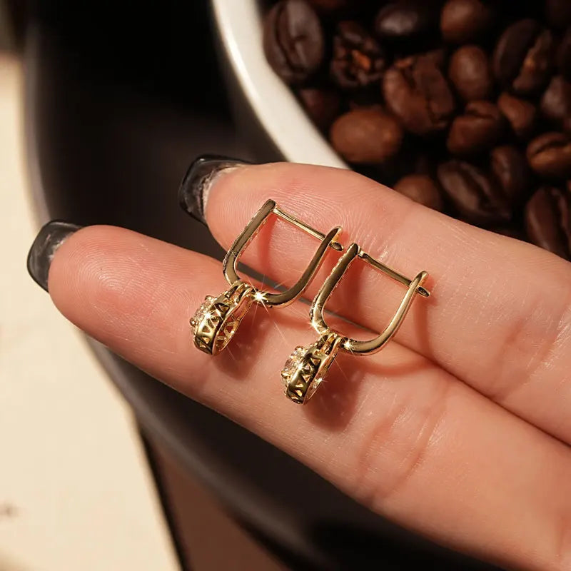 Lock-Style Halo Moissanite Drop Earrings in Sterling Silver - Gold-tone rear settings on hand