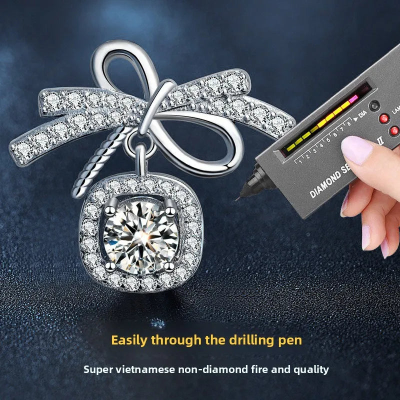 Moissanite Bow Stud and Drop Earrings in Sterling Silver — Bow earring stone demonstration — BandsCo Straps