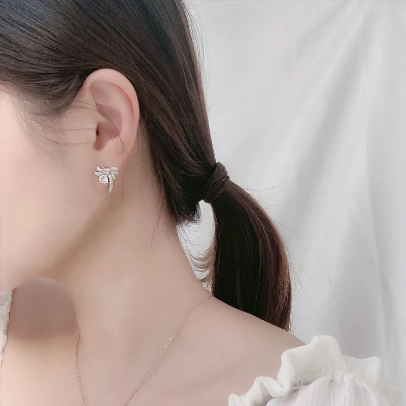 Moissanite Bow Stud and Drop Earrings in Sterling Silver — Ribbon studs worn on ear — BandsCo Straps