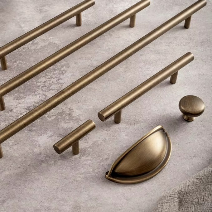 Smooth solid brass bar pulls with a round knob and cup pull in antique brass