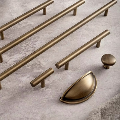 Smooth solid brass bar pulls with a round knob and cup pull in antique brass